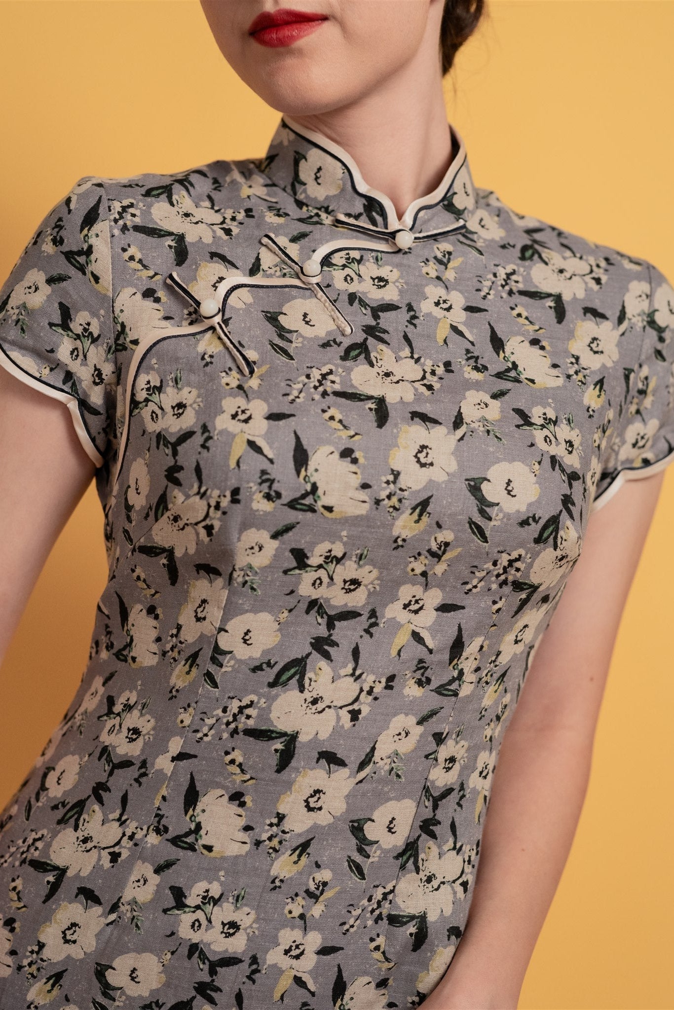 Close-up of floral Japanese cotton fabric on modern Qipao dress. 