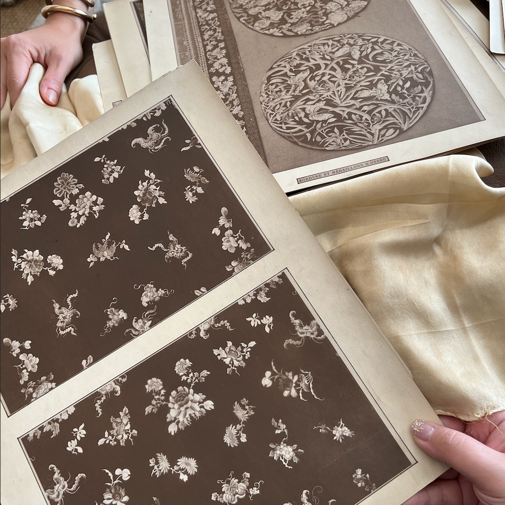 Grace's consultation with client about fabric pattern and embroidery.