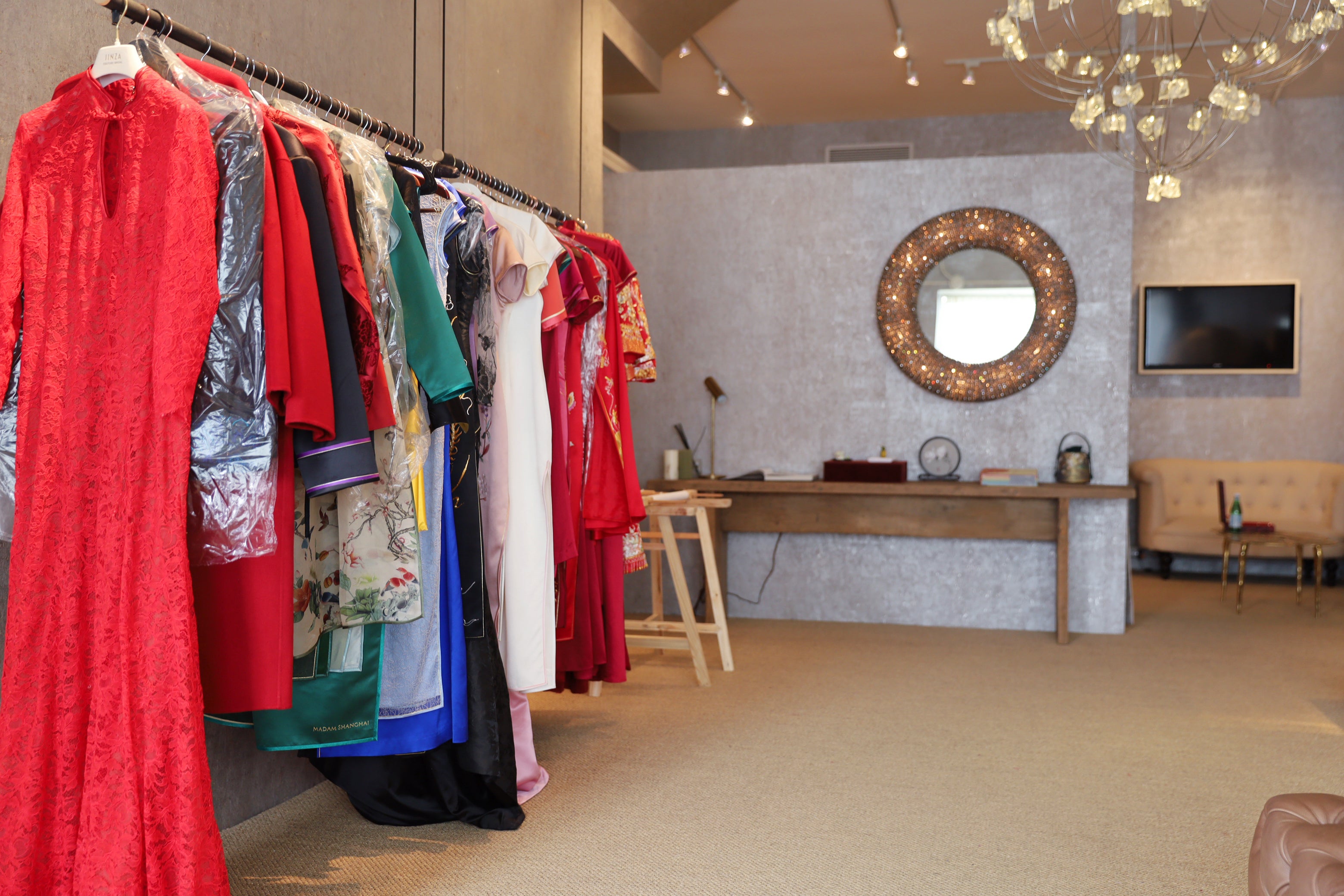 Jinza Oriental Couture Los Angeles store photo, showing a rack of Qipao dresses and decorations in the store.