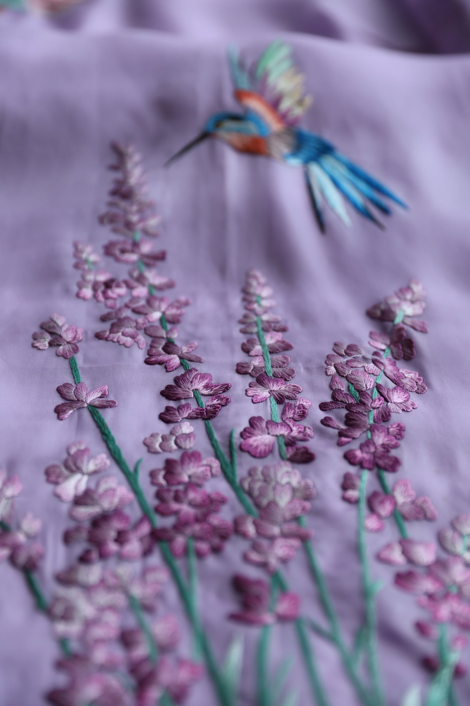 Close-up of lavender embroidery on the silk organza Cheongsam for mother. 