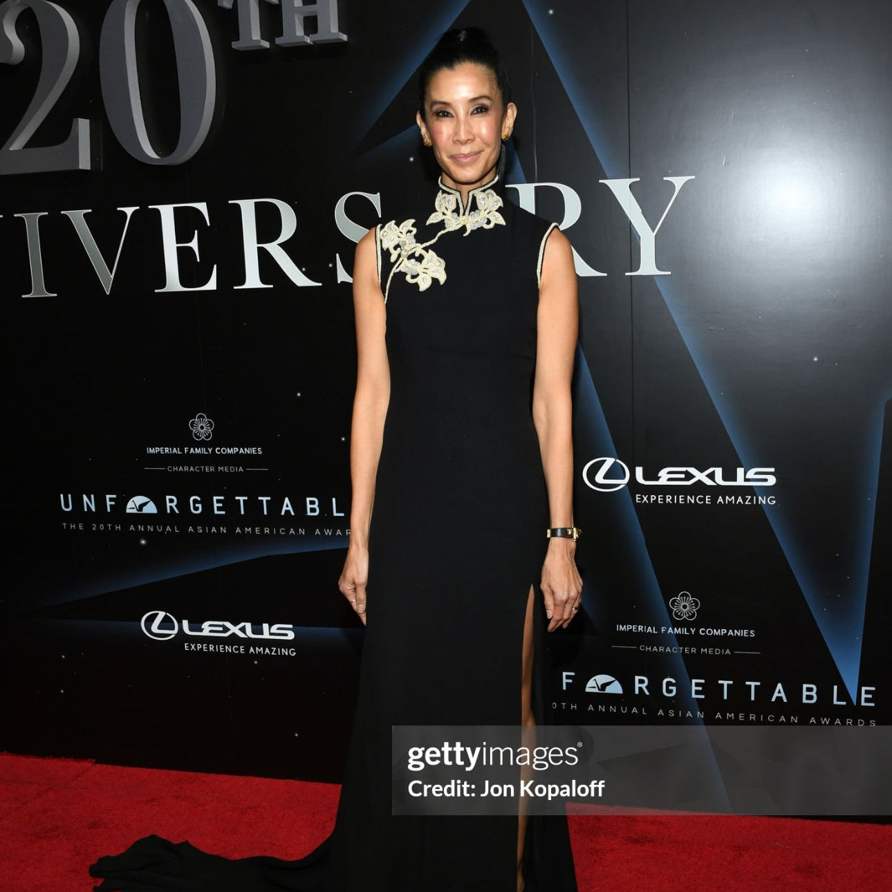 Lisa Ling wearing a black silk crepe modern Cheongsam with Indian hand embroidery, blending tradition with contemporary elegance.