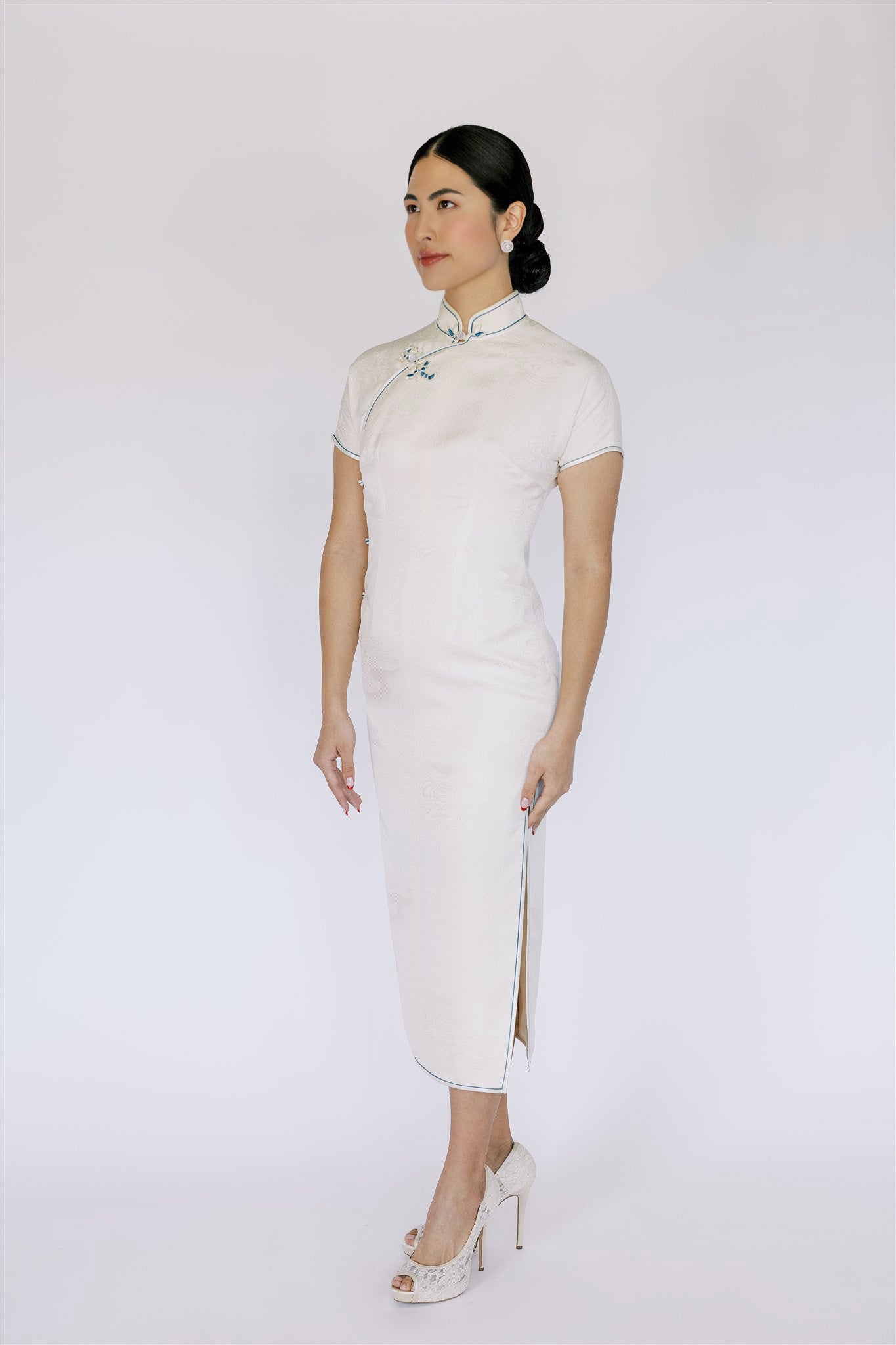 Contemporary white Qipao with traditional elements, it is a perfect blend of classic and modern design.