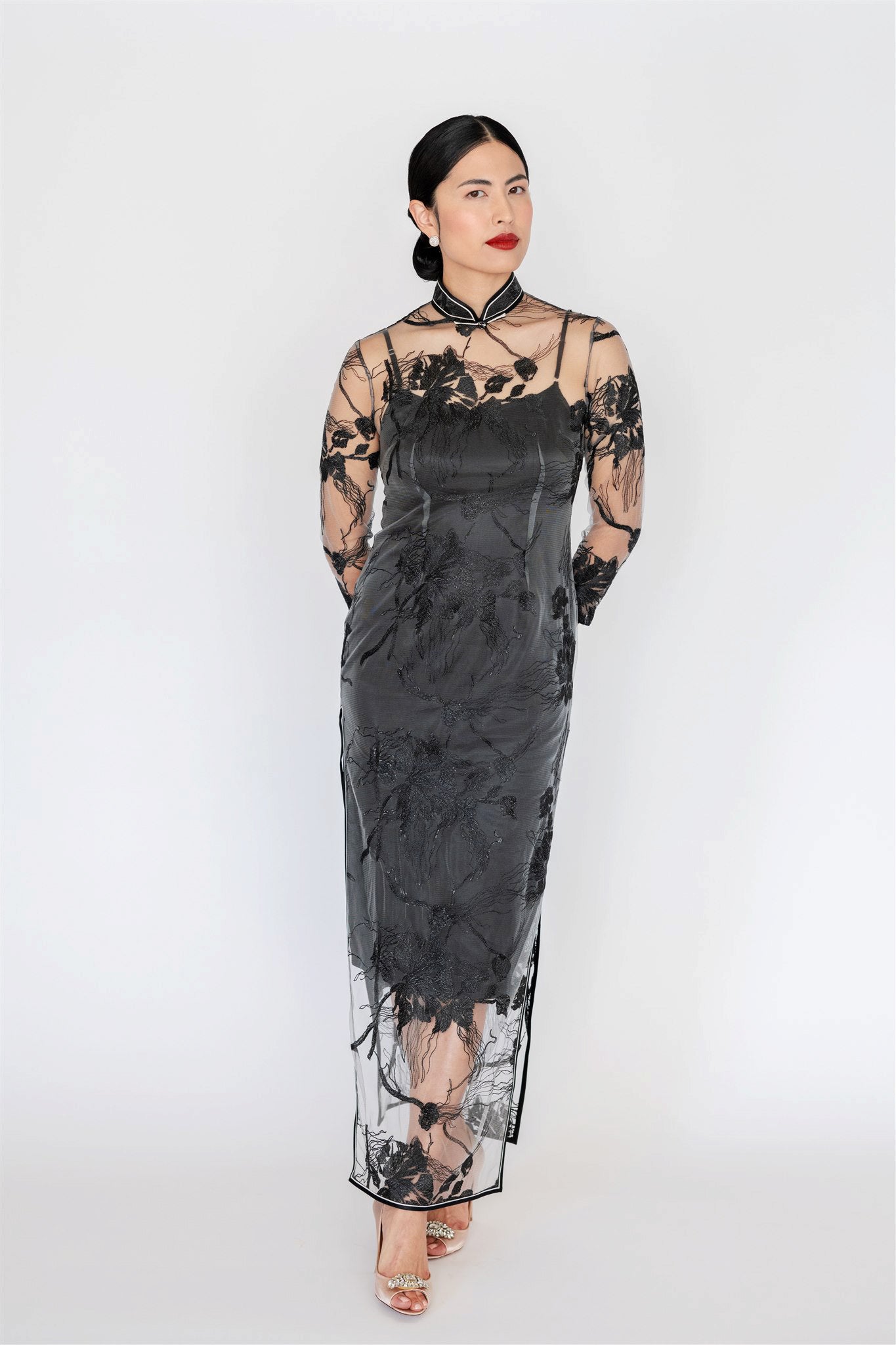 Modern black lace cheongsam dress with silk slip, front view