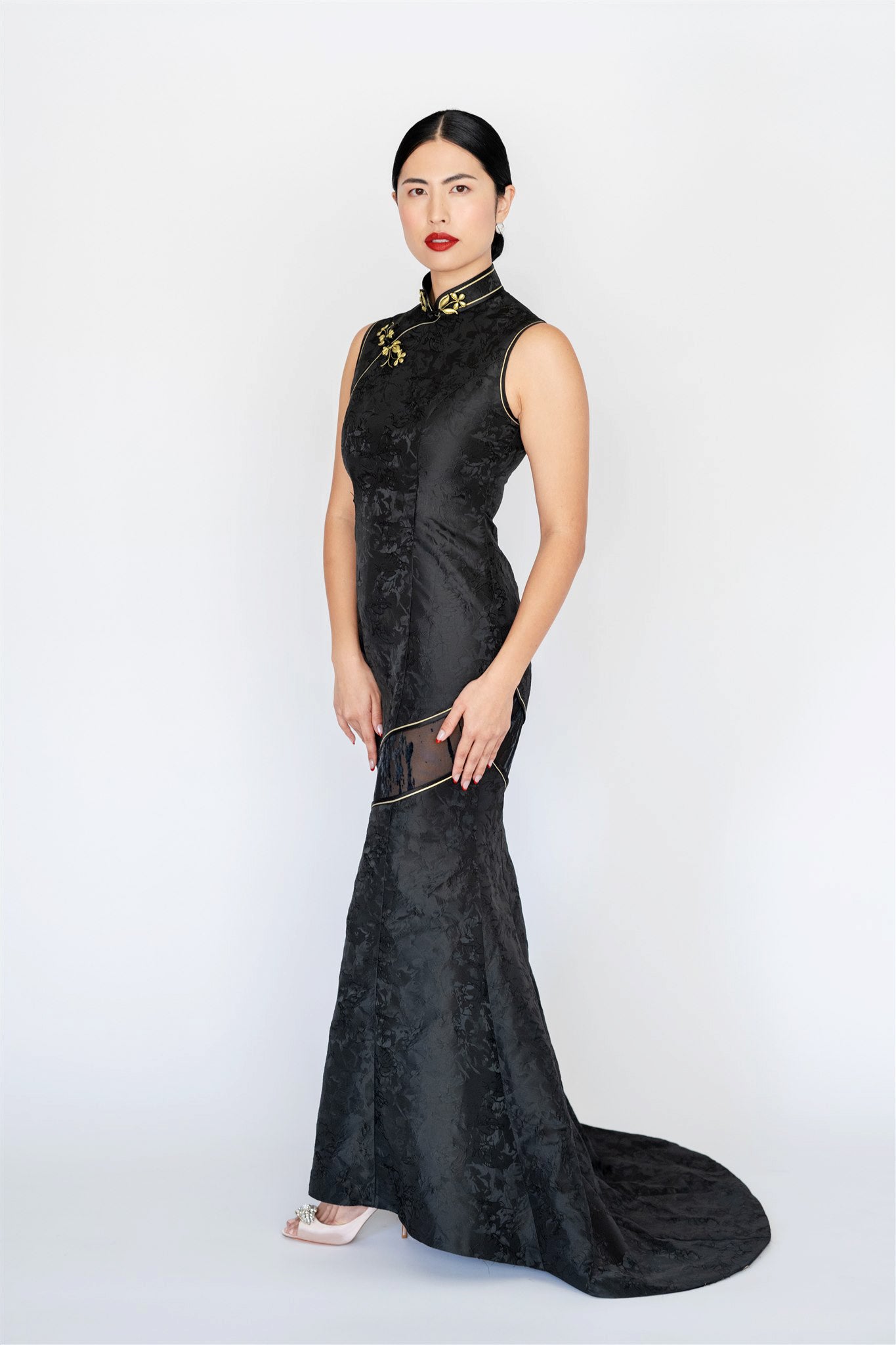 Modern black silk brocade Cheongsam dress with halter neckline and mermaid silhouette.