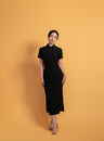 Front view of an elegant Qipao dress in black lace, it is a sophisticated Chinese dress with a classic silhouette.