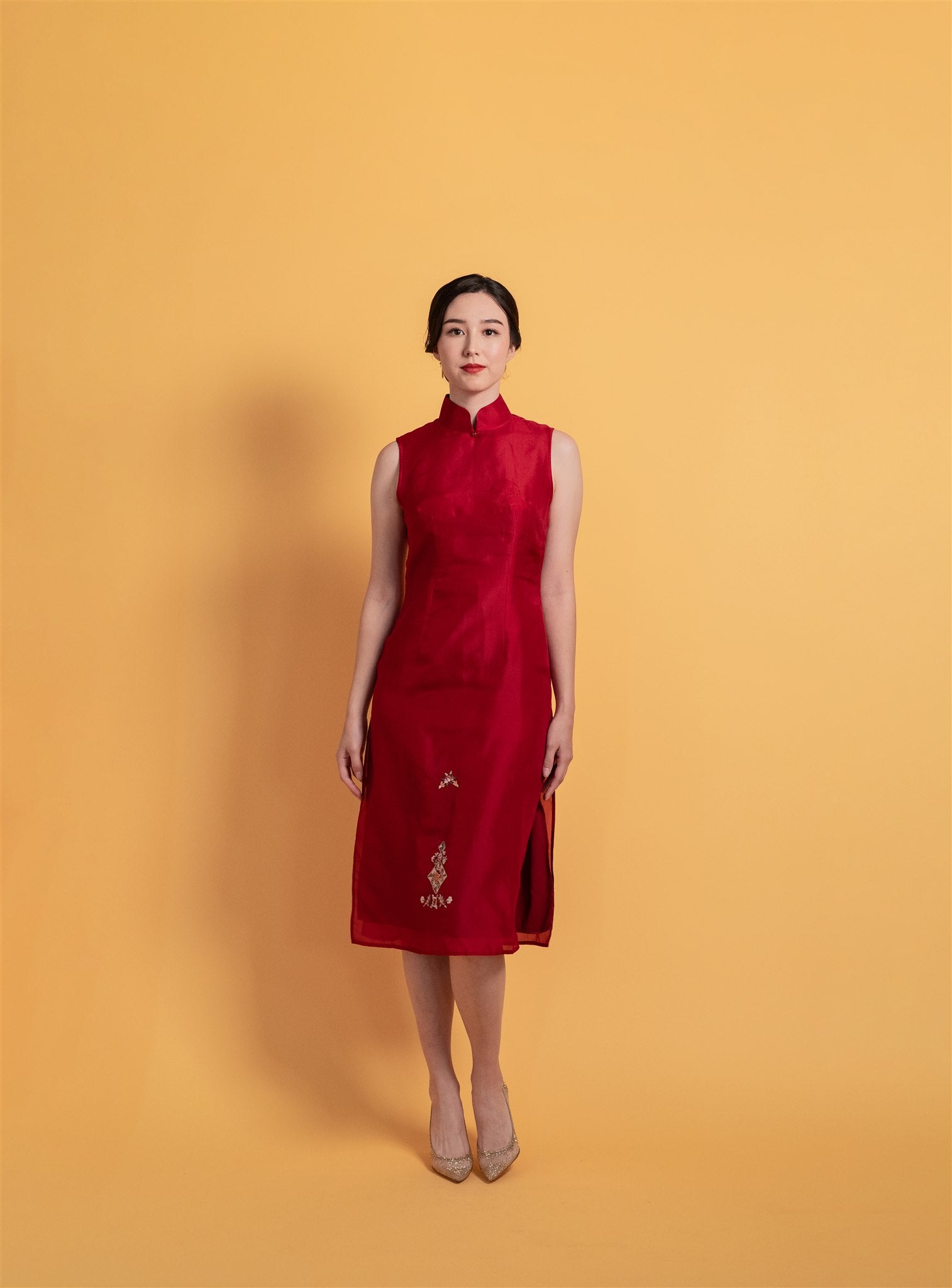 Front view of a modern wine red silk organza A-line Cheongsam dress, an elegant Chinese dress with a modern silhouette. 