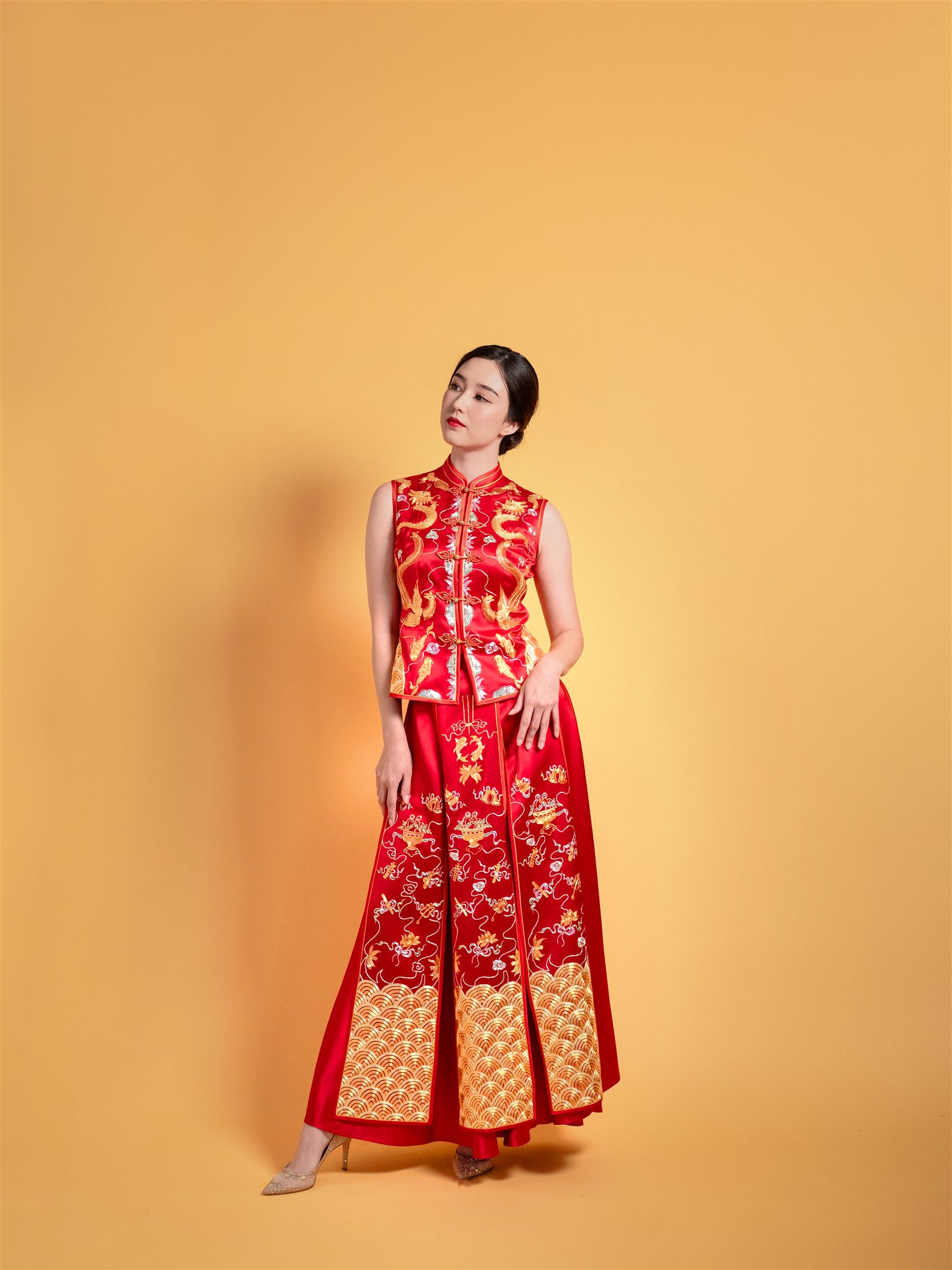 Side view of sleeveless red Xiu He Fu with 8-panel skirt and phoenix embroidery
