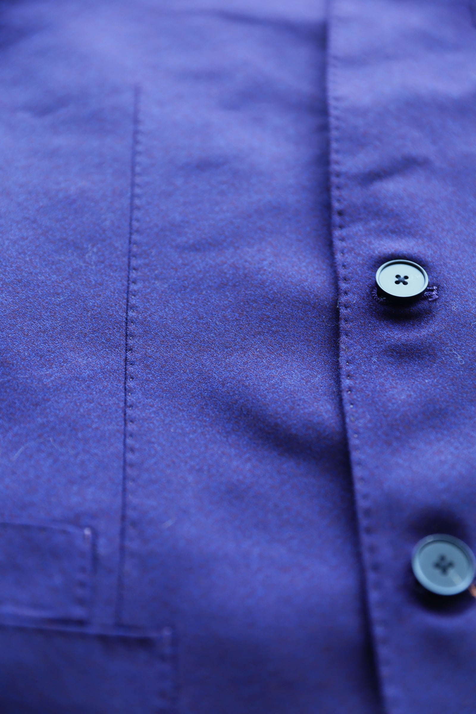 Hand-finished buttons and front panel stitching on Italian wool Zhongshan suit.