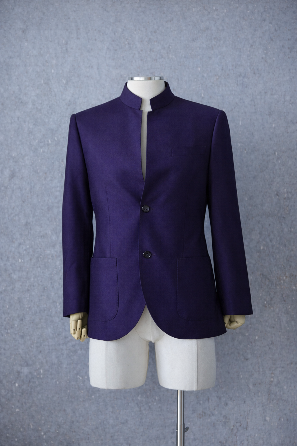 Modern purple Italian wool Zhongshan suit with open neckline and tailored silhouette.