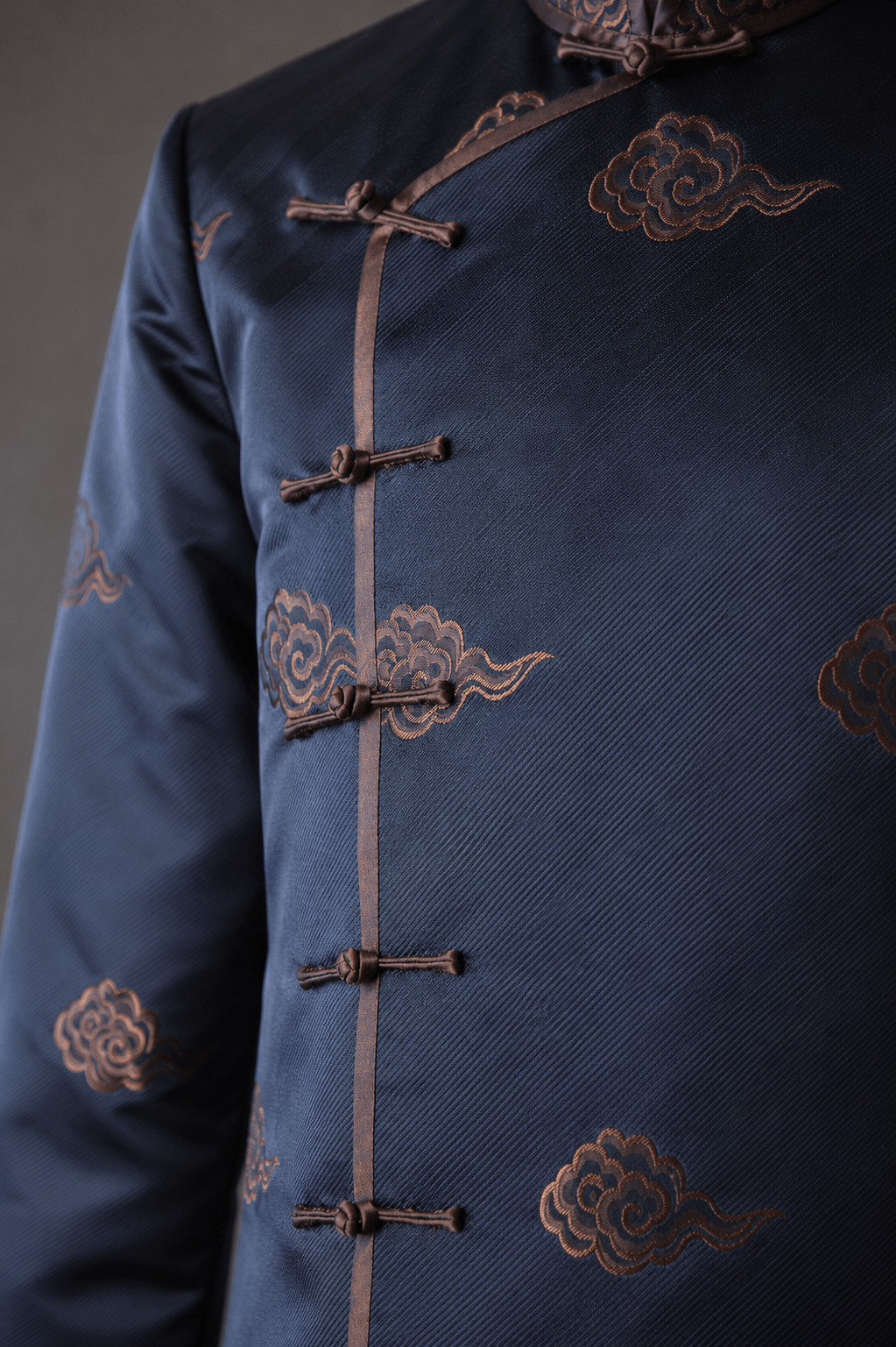 Pankou knot closure detail on navy charcoal silk brocade Tang suit with lucky cloud pattern — ready to wear by JINZA Oriental Couture, Los Angeles
