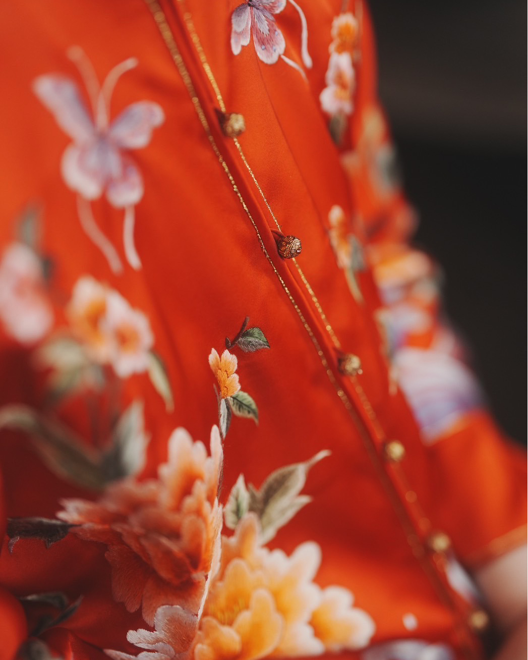 A red Xiu He Fu with butterfly and peony embroidery