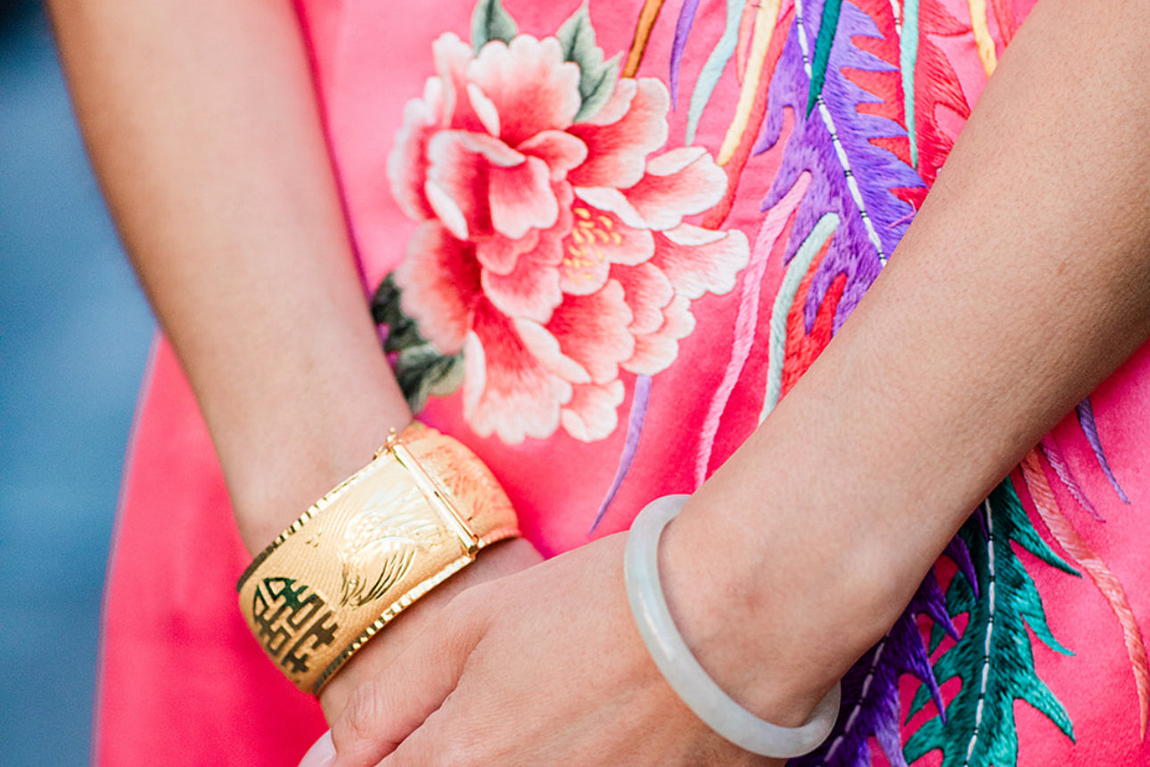 Close-up of a peony hand embroidery on a red wedding Cheongsam