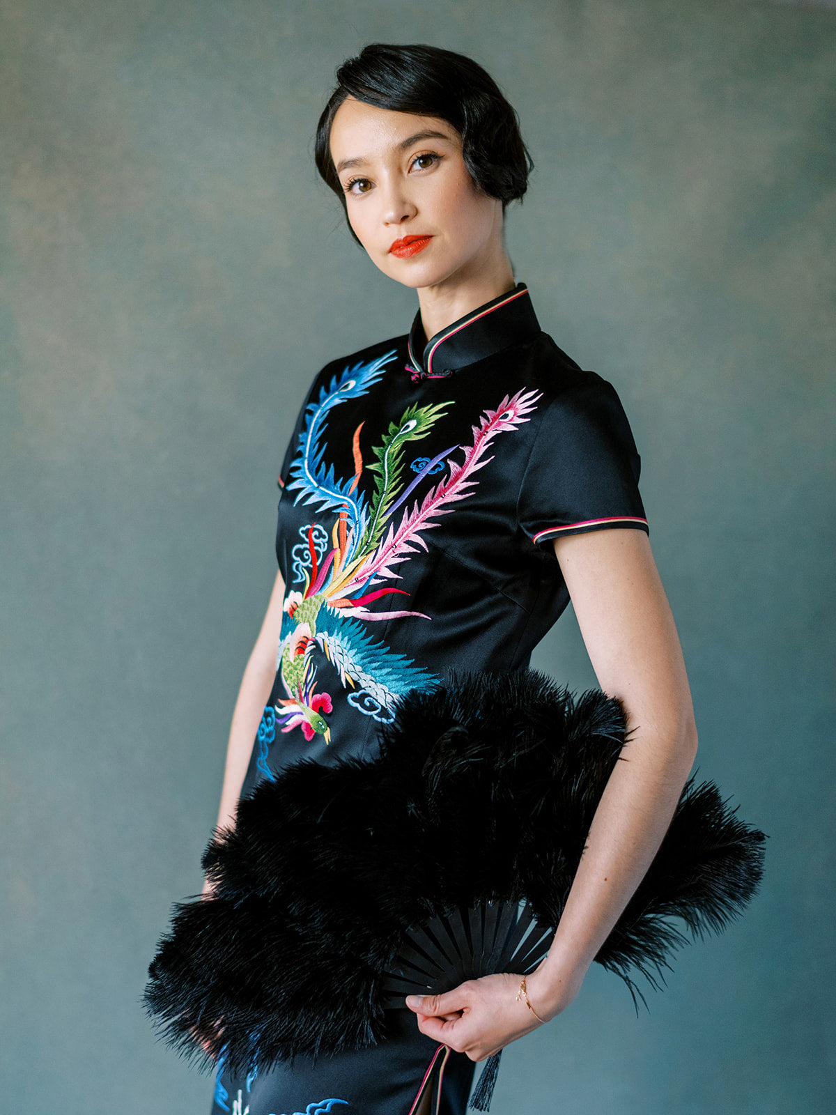 Rainbow phoenix embroidery detail on black silk Chinese dress