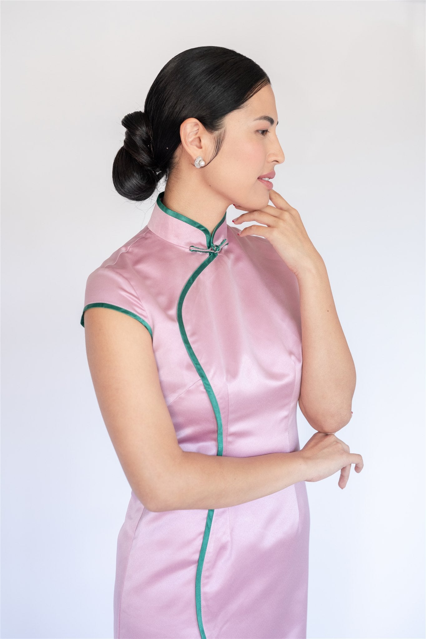 Green trim detail on pink silk cheongsam evening gown