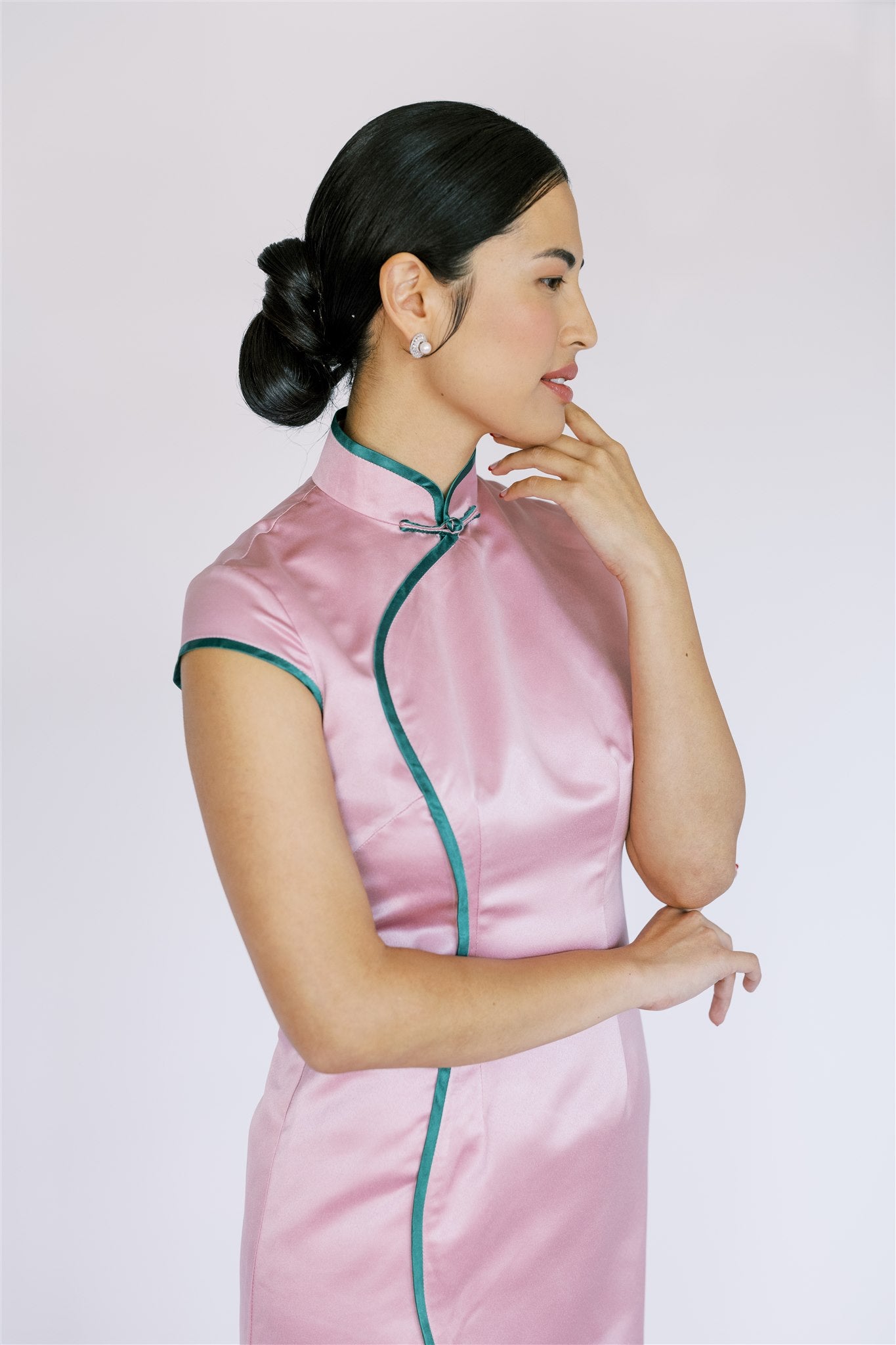 Details of green piping on pink silk satin Cheongsam, a perfect vibrant contrast enhancing the design.