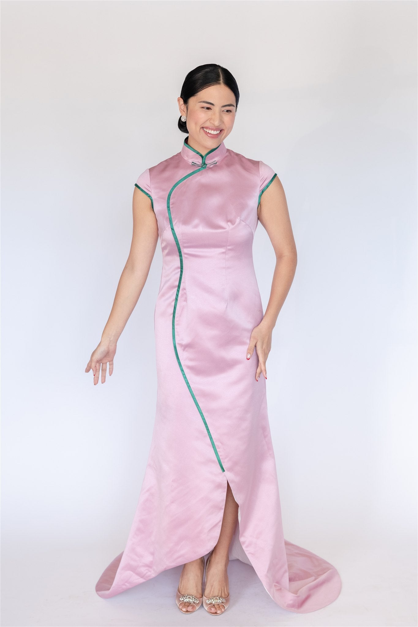 Pink silk cheongsam with mermaid silhouette and green trim