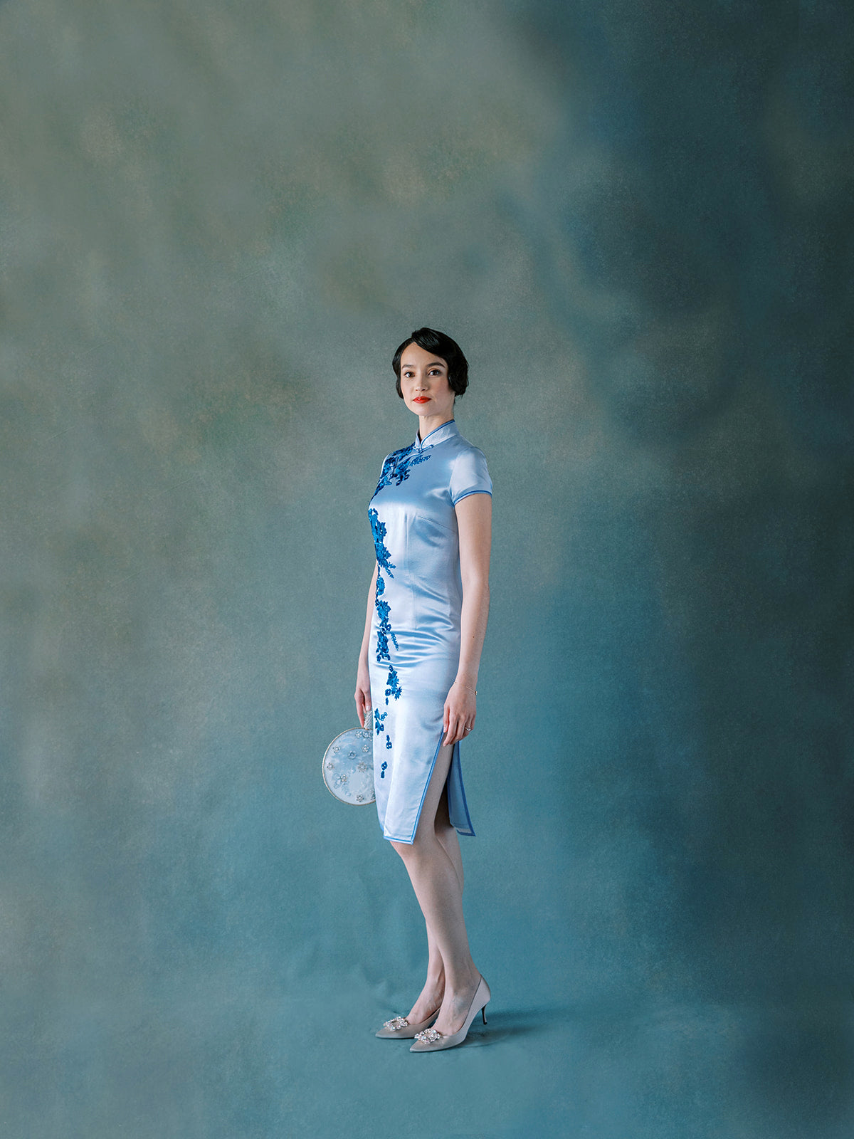 Front view of purple silk Qipao with velvet flower appliqué