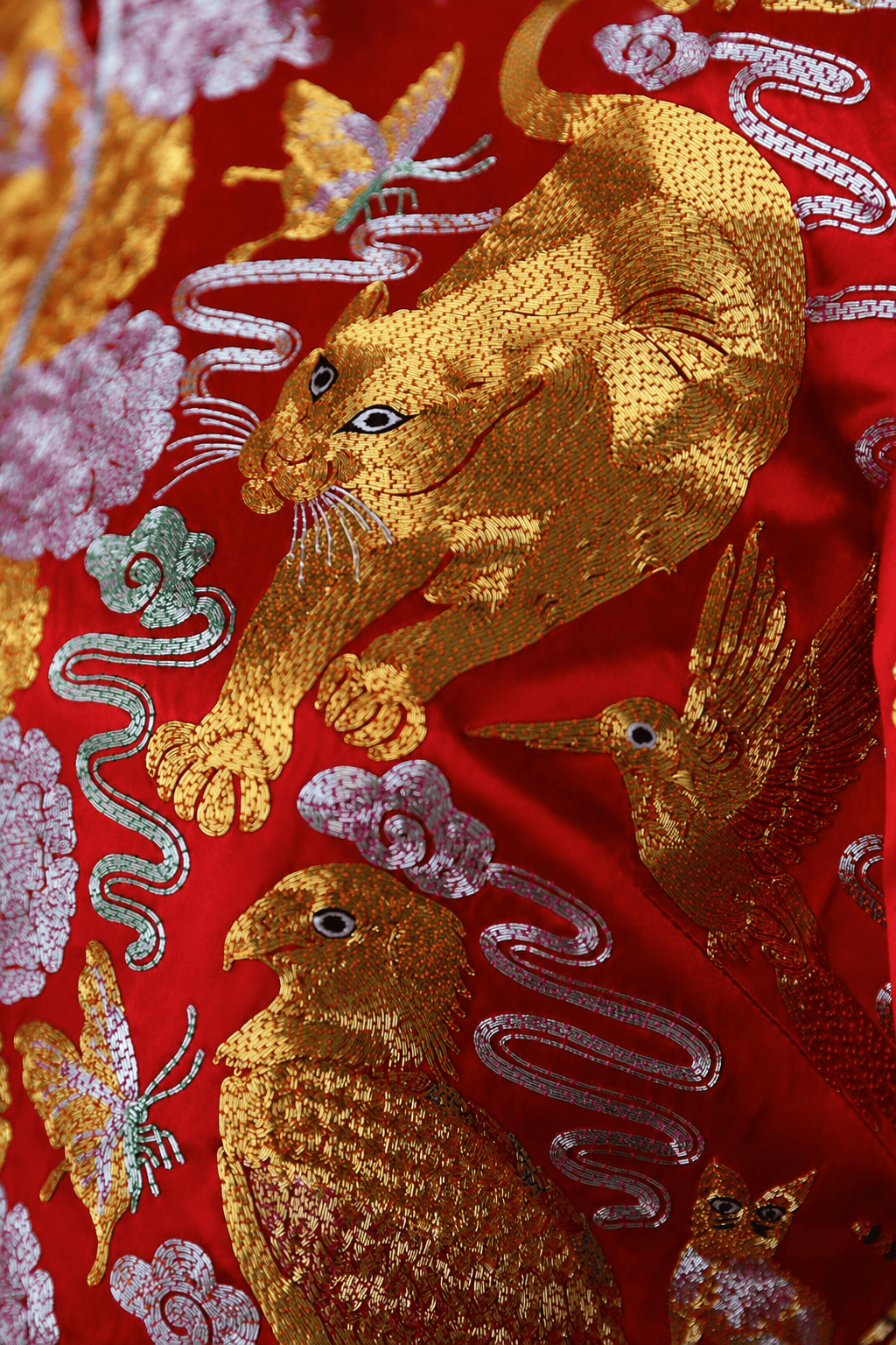 Hand embroidered cheetah and phoenix detail on a ready to wear red silk Qun Kwa with multicultural embroidery — JINZA Oriental Couture, Los Angeles