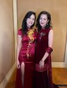 Real client wearing a wine red silk velvet mermaid Cheongsam dress at a gala, showcasing timeless elegance.