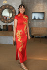 A client wearing her red custom wedding Qipao with moon, phoenix and dragon embroidery