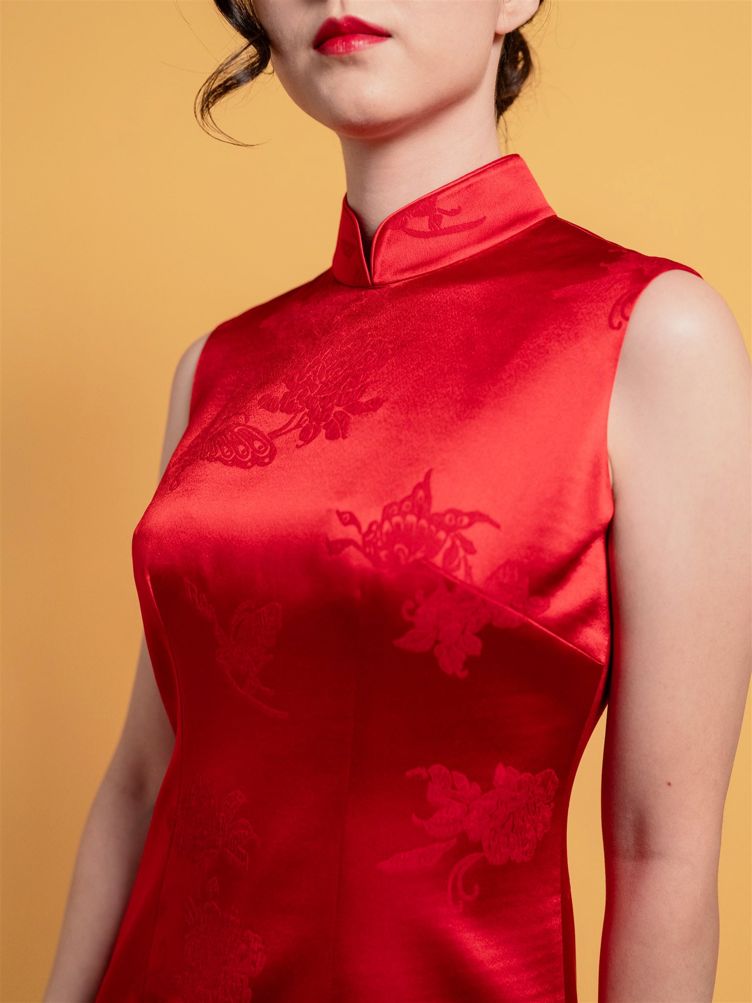 Close-up of butterfly and peony print on red silk fabric of wedding Qipao by JINZA Oriental Couture