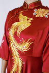 gold phoenix and peonies on a red wedding dress 