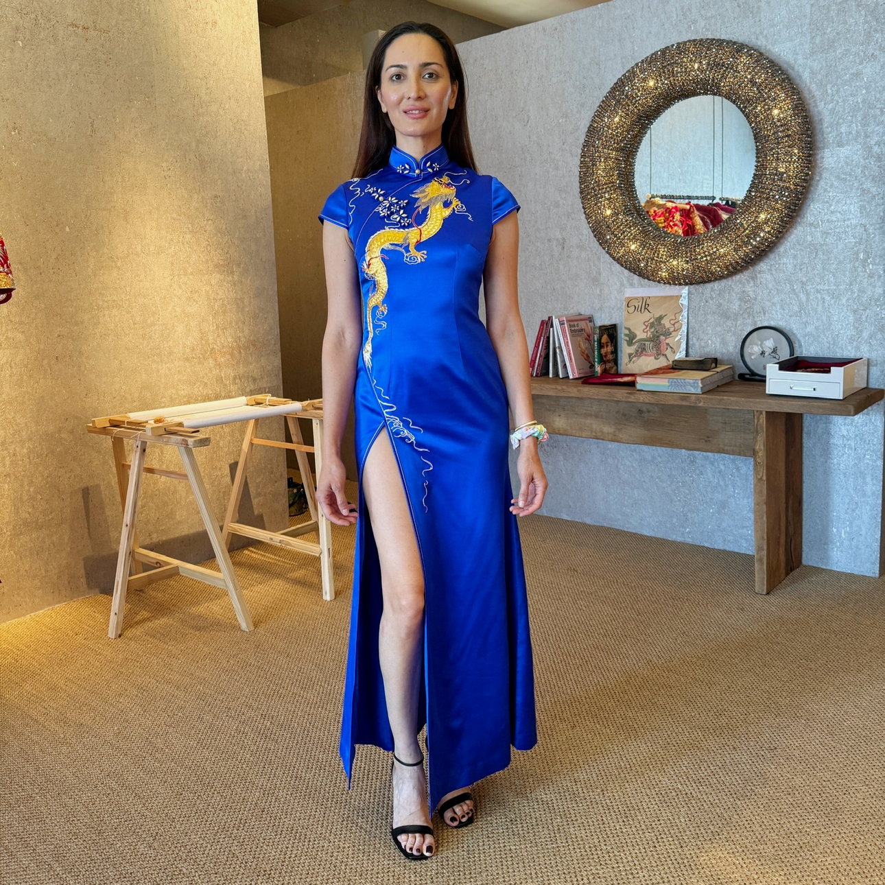Real client wearing royal blue silk modern Cheongsam with gold dragon Panjin embroidery and cap sleeves, custom made by JINZA Oriental Couture