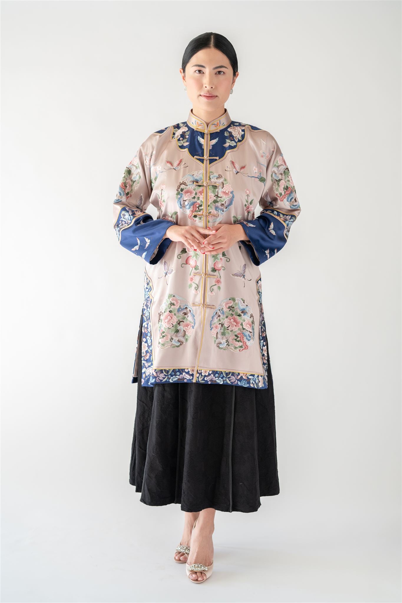 Front view of silver two-piece Cheongsam with embroidered floral jacket and A-line skirt