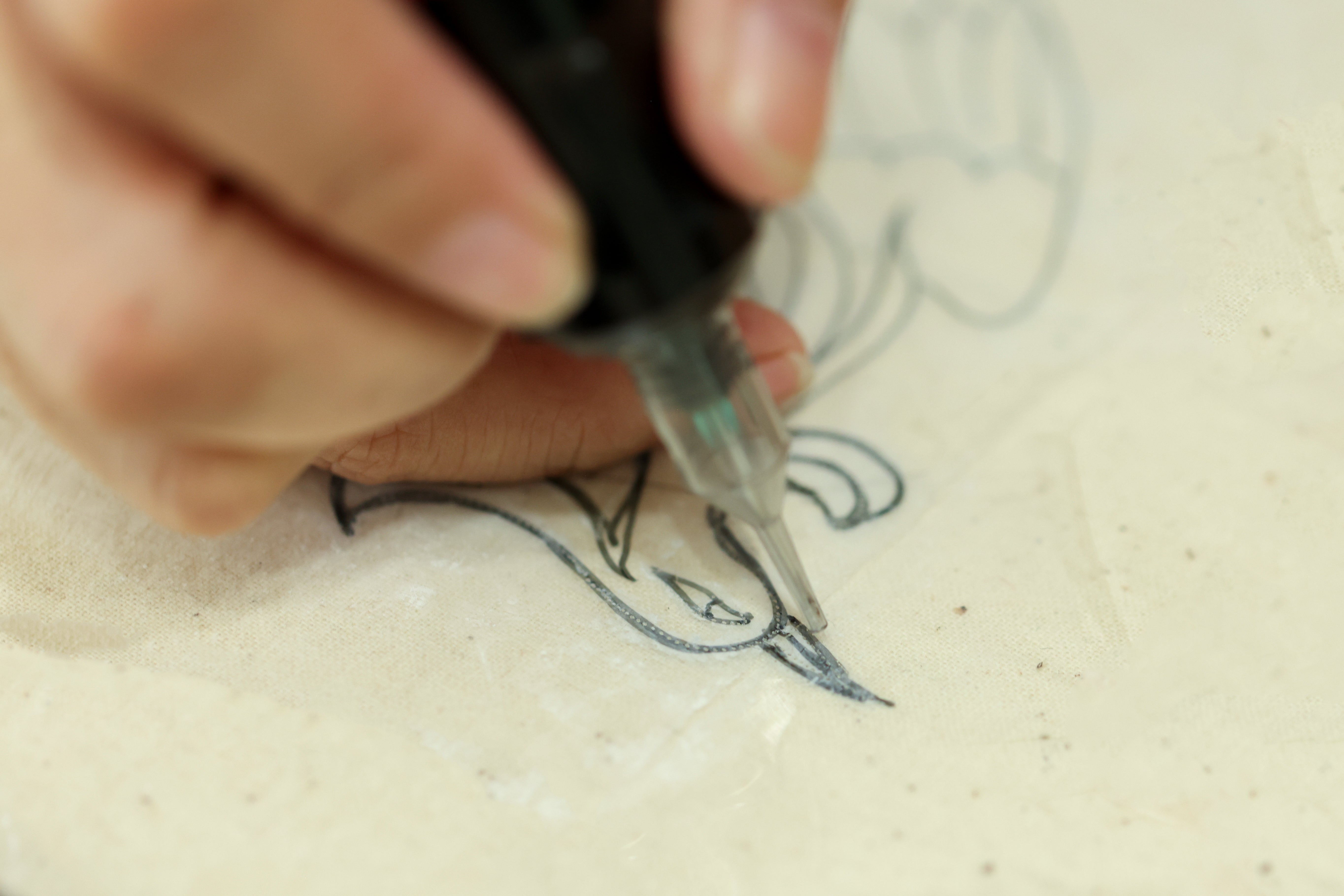 Custom Qipao embroidery sketch by artisan at JINZA 