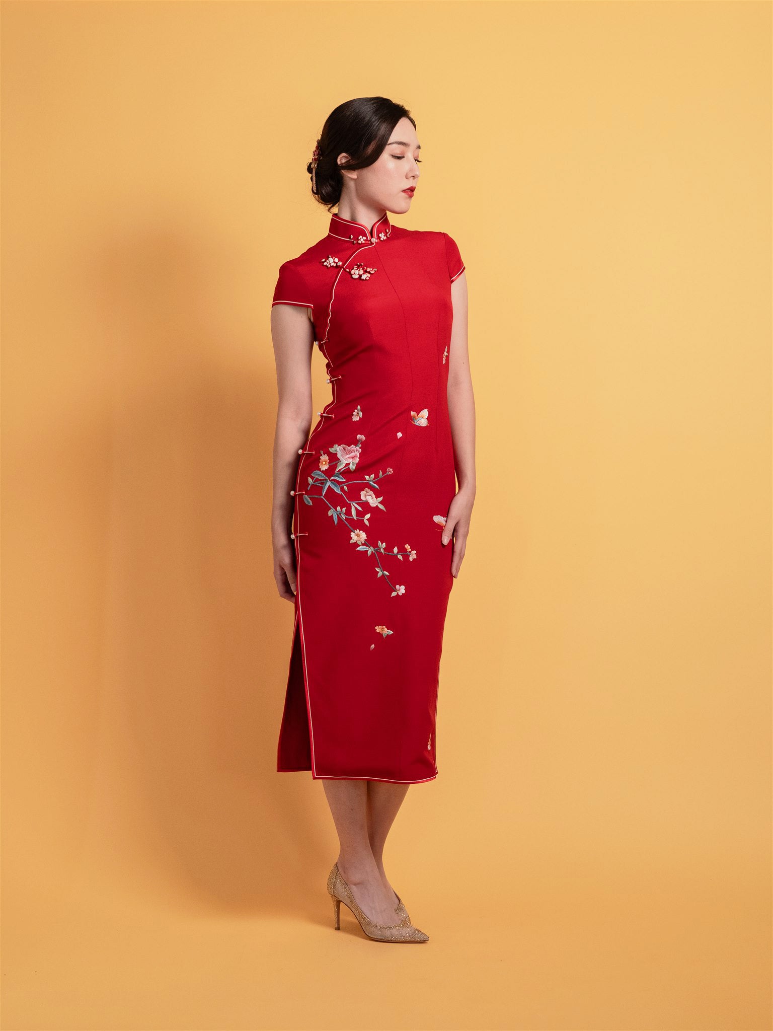 Side view of red Chinese tea ceremony Qipao in Japanese silk
