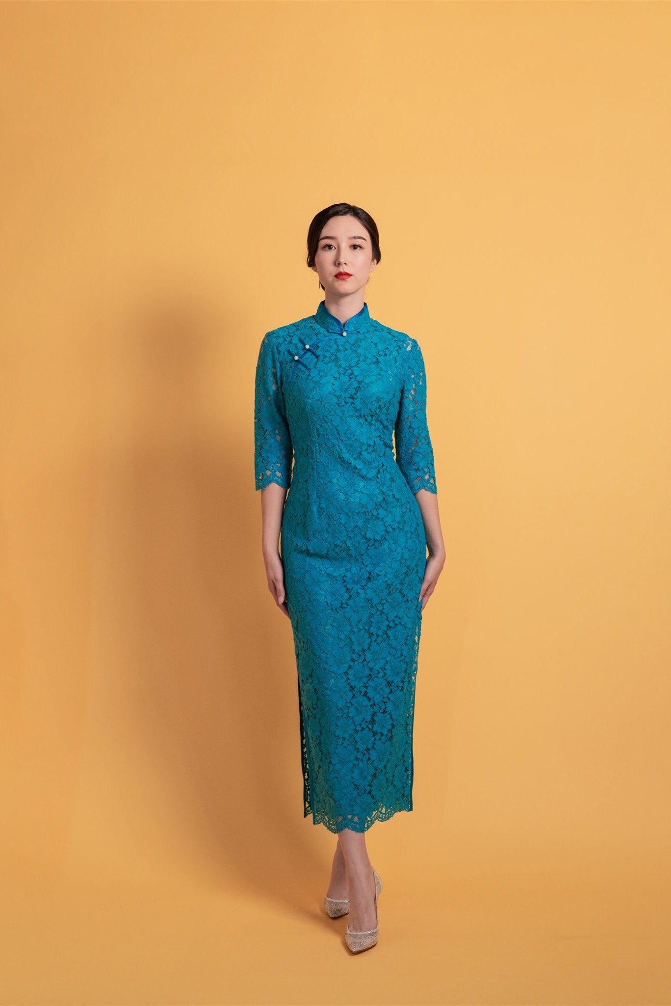 Teal lace cheongsam with 3/4 sleeves and silk slip dress, front view