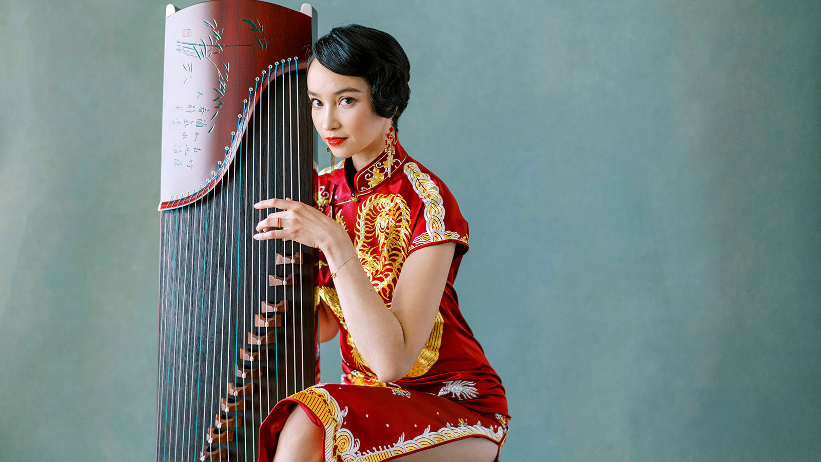 Traditional Qipao dress in green silk with vintage Shanghai background