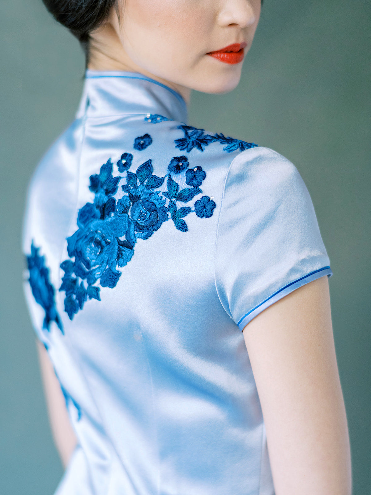 Hand-sewn velvet flower detail on purple Chinese dress