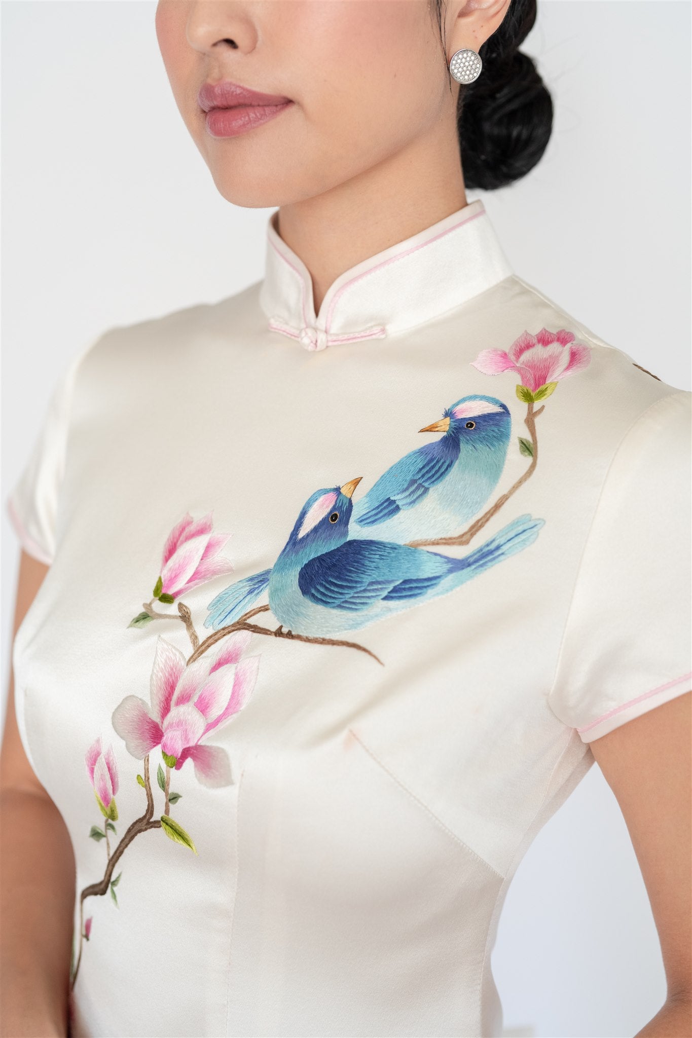 Hand-embroidered magnolia and pomegranate on white silk qipao