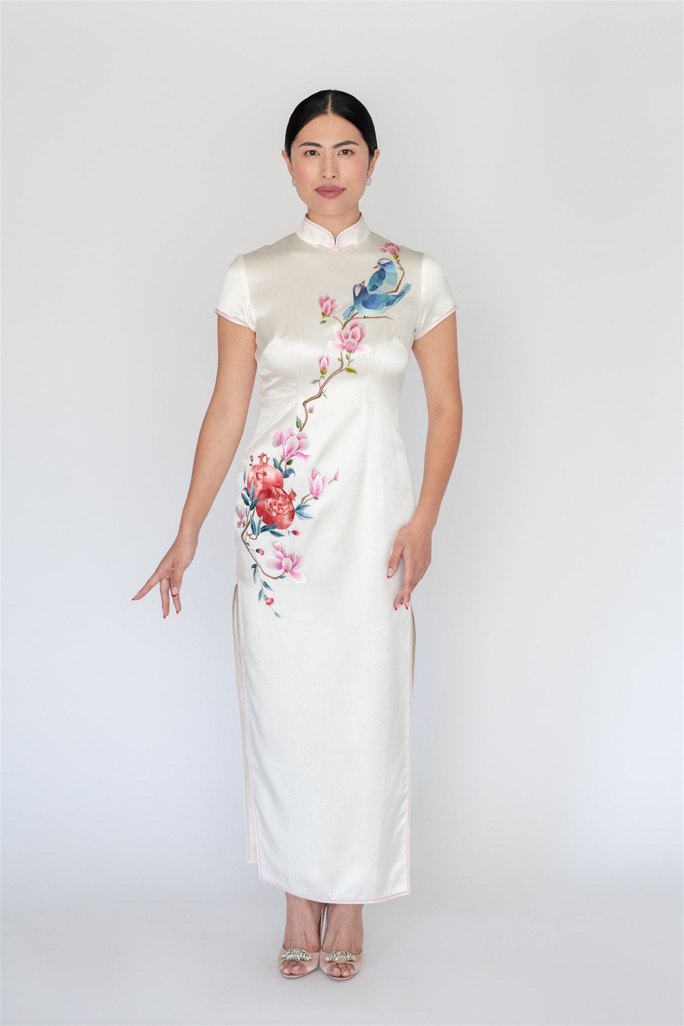 White silk cheongsam with magnolia and pomegranate embroidery, front view
