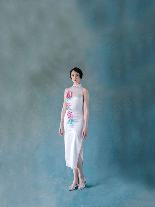 Front view of white silk halter Qipao dress with 3D embroidered peony motif.