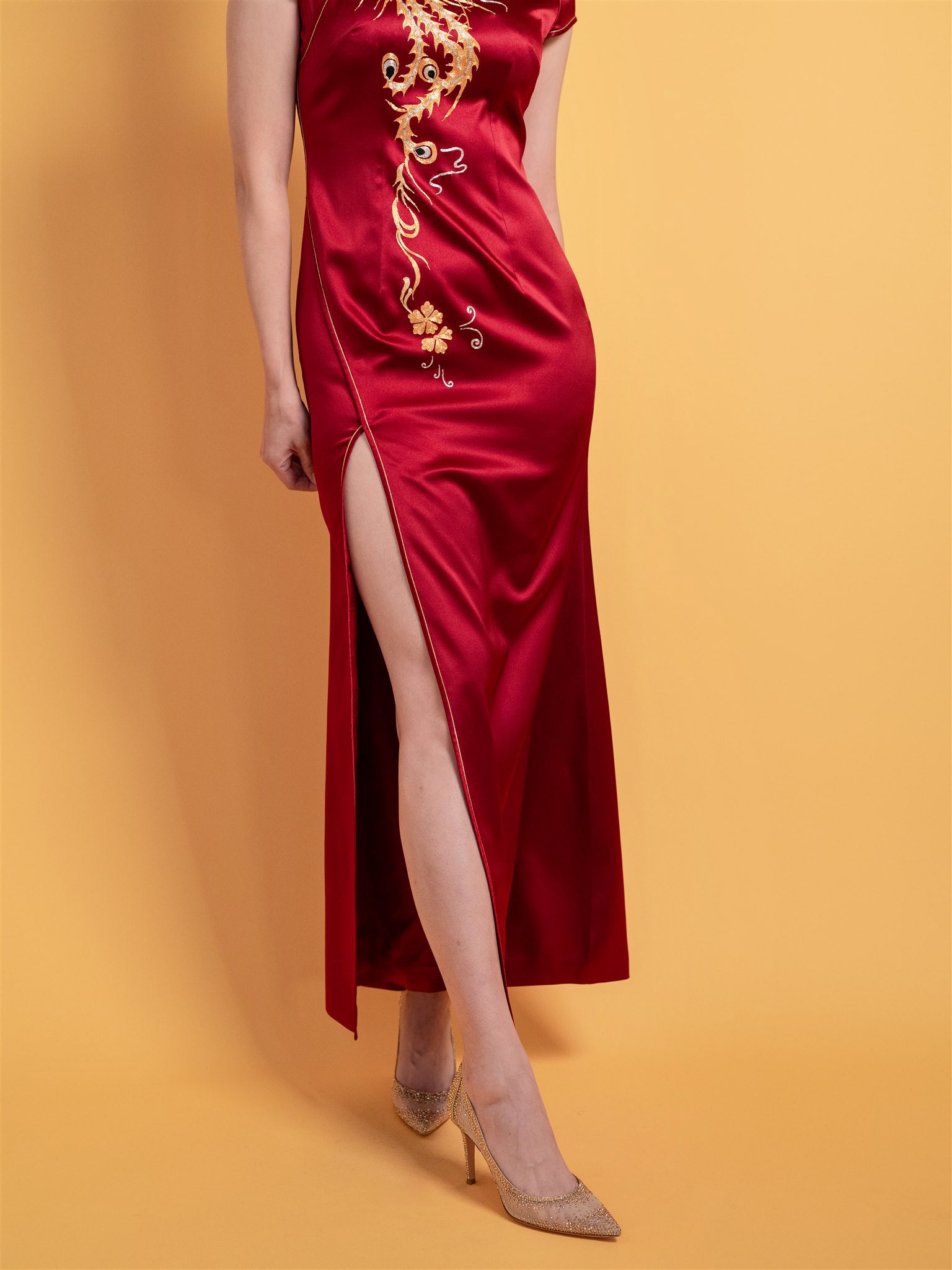 Pankou button and front slit detail on wine red Chinese wedding dress with gold trim