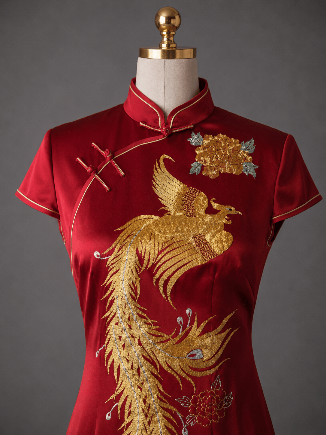 Hand embroidered gold phoenix rising with peony in Panjin technique on wine red silk A-line Qipao — detail shot by JINZA Oriental Couture, Los Angeles