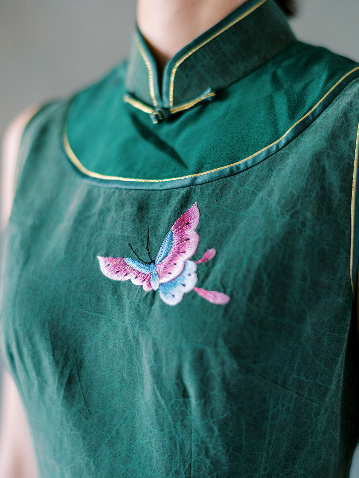 Hand embroidered butterfly on emerald Xiang Yun silk Qipao